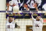 Lemoore's Alexia Vancil (11) and Isabella Stevens (14) combine to block a shot in a 3-0 loss to El Diamante on Wednesday.